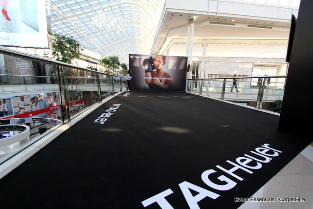 Two media walls, black carpet and decal branding